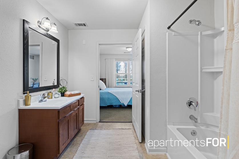 a bathroom with a bathtub and sink