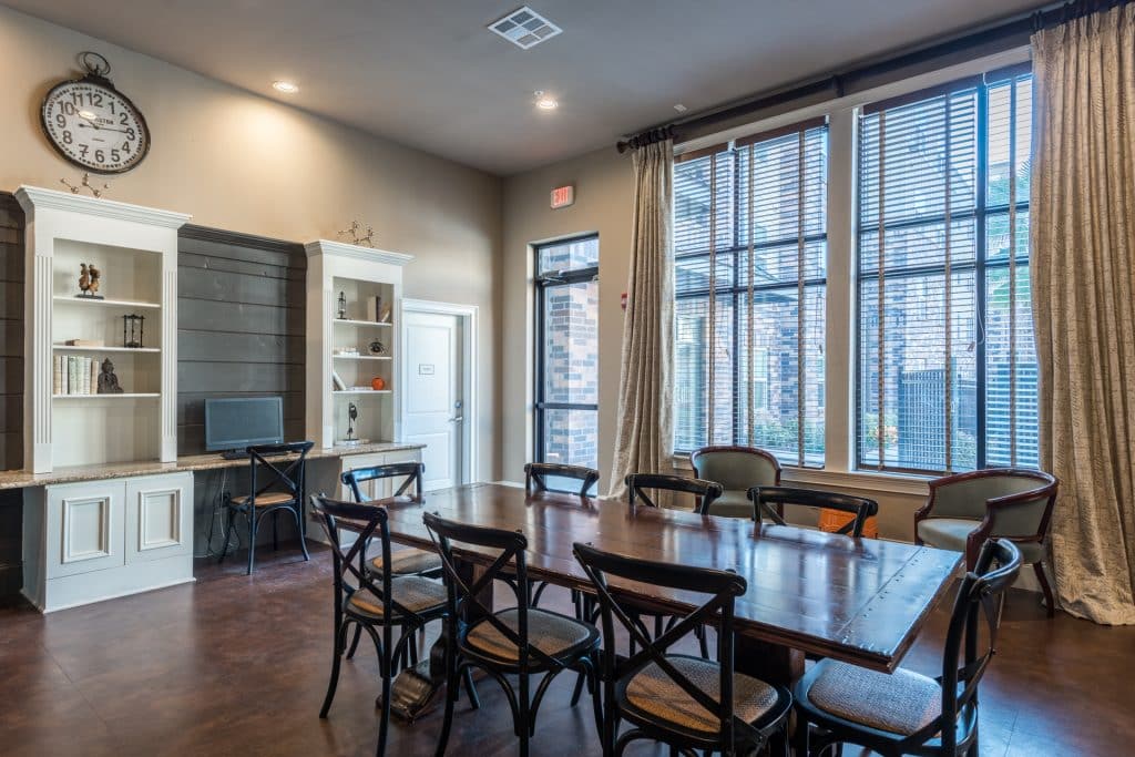 a room with a table and chairs