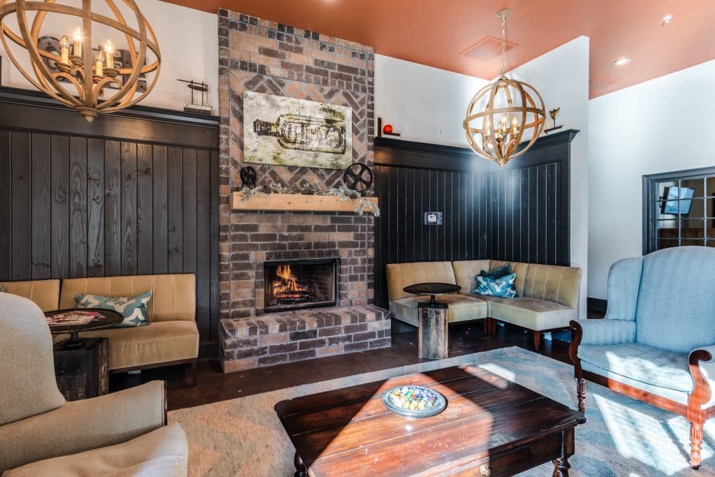 a living room with a fireplace and couches