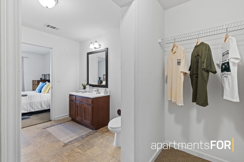 a bathroom with a mirror and a toilet