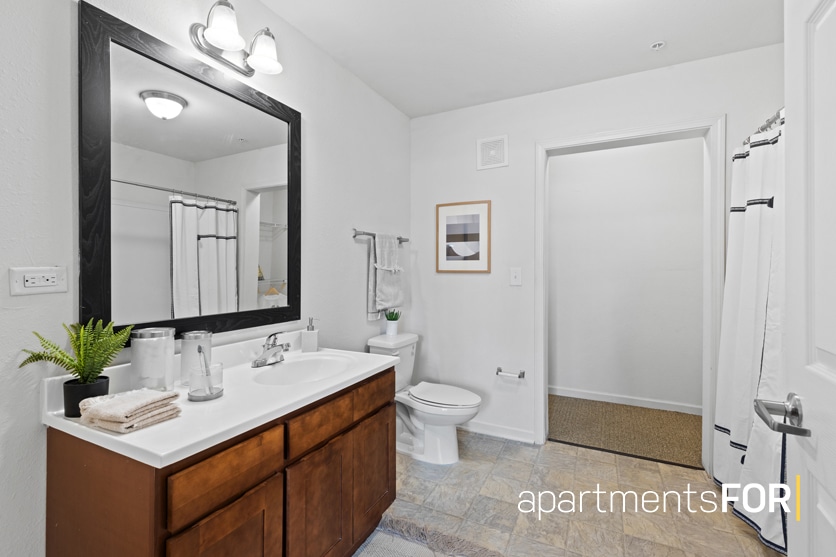 a bathroom with a mirror and sink