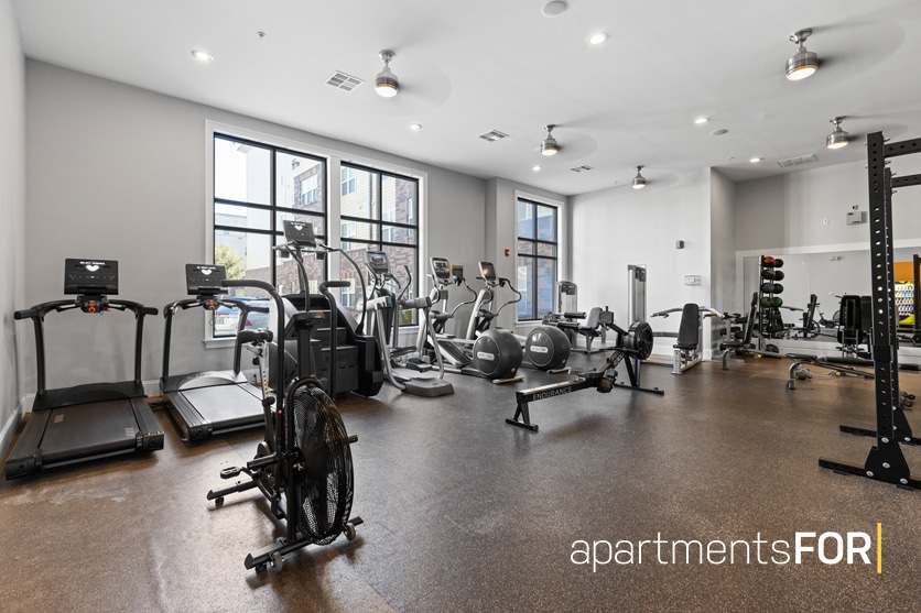 a large room with exercise equipment